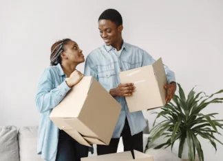 young couple moving new home together african american couple with cardboard boxes 1157 40314.jpg