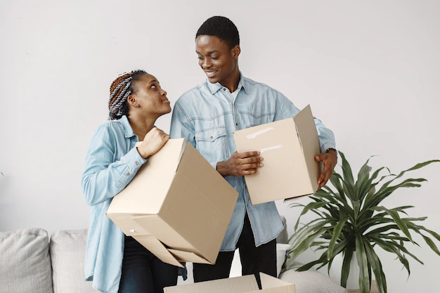 young couple moving new home together african american couple with cardboard boxes 1157 40314.jpg