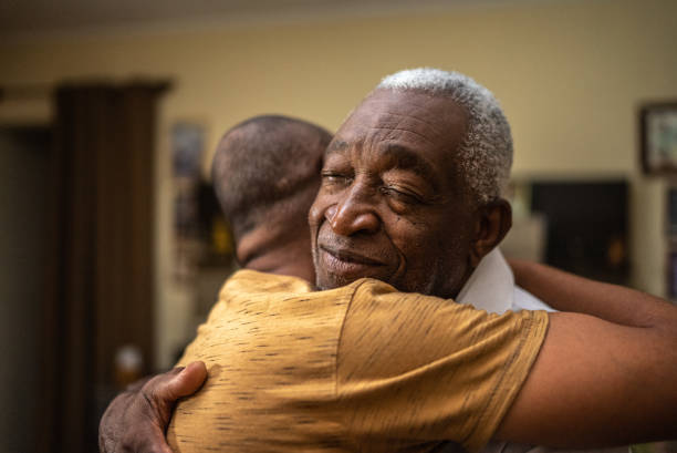 Bonding moment of father and son embracing and giving emotional support at home