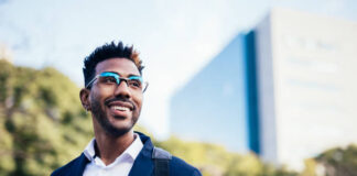 Portrait of dreamy young black man looking at infinity in a park