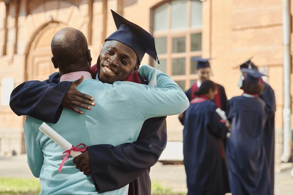 father congratulating his son graduation 600nw 2360923061.jpg