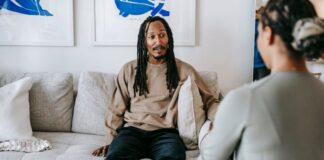 black man having conversation with psychologist