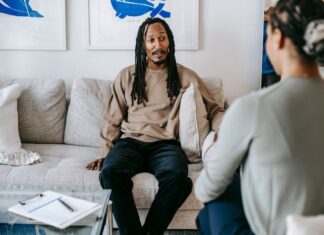 black man having conversation with psychologist