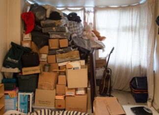 brown cardboard boxes on black steel rack