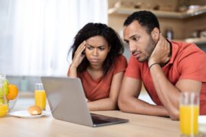 couple discussing about floor plans couple discussing about floor plans