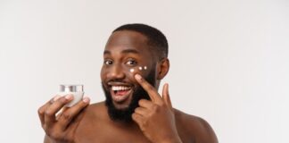 handsome man applying cream