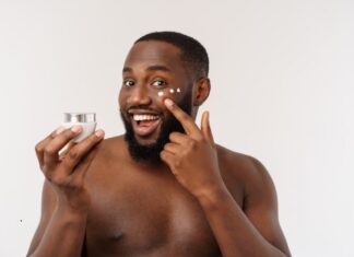 handsome man applying cream