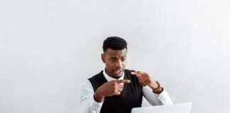 lawyer in white dress shirt sitting at the table