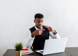 lawyer in white dress shirt sitting at the table