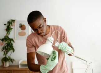 man repairing lamp