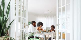 people sitting on chairs in front of table