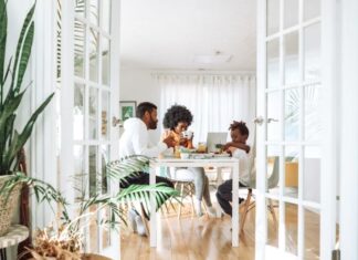 people sitting on chairs in front of table