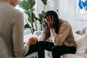 stressed black man with dreadlocks