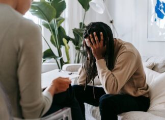 stressed black man with dreadlocks