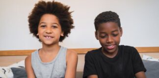 two-brothers-playing-video-games-home