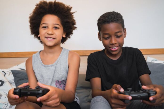 two-brothers-playing-video-games-home