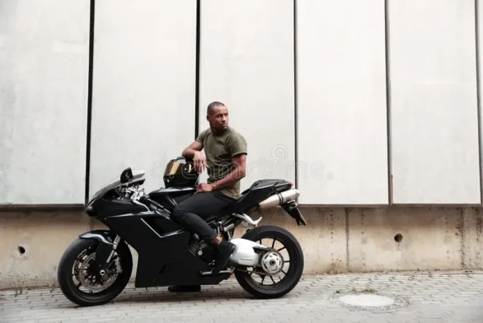 portrait young afro american man sitting motorcycle outdoors portrait young afro american man motorcycle 103055287.jpg